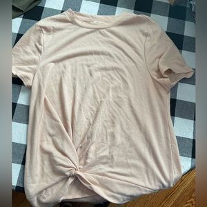 Light pink sweater/shirt. Size M. Runs small.